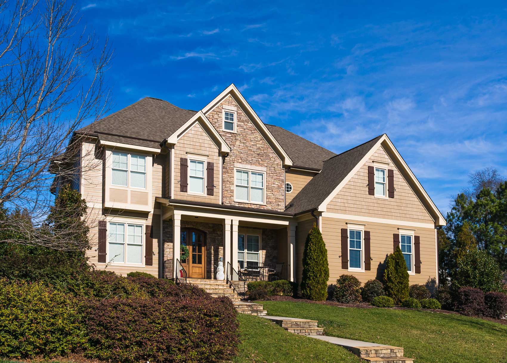 Home with a professionally installed roof by Tip Top Roofing