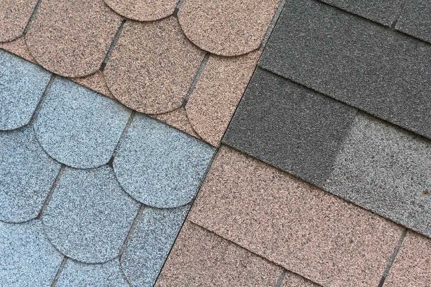 Asphalt shingle roofing material samples in several colors
