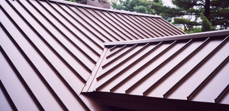 Standing seam metal roof panels with concealed fasteners